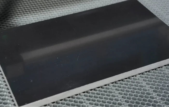 Placing-marble-on-laser-engraving-machine-work-area.webp